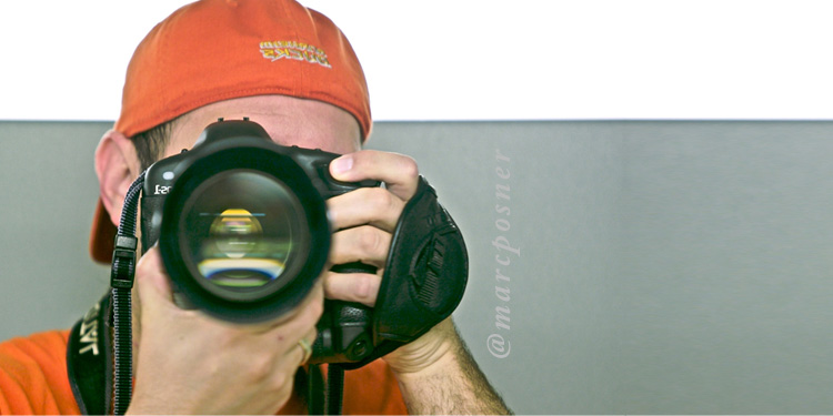 a self portrait showing me holding a camera while taking a picture